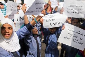 Palestinian Refugees Rally Outside of UNRWA Office in Amman