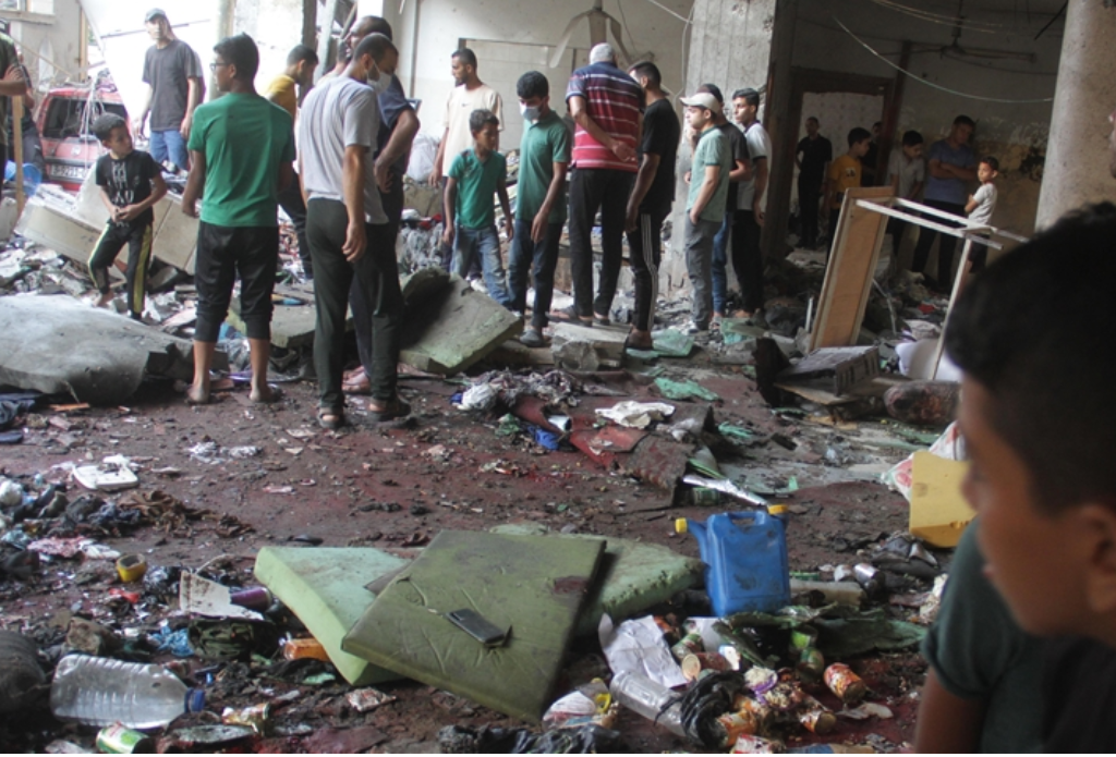 Israeli Military Kills at Least 100 Palestinians in Gaza School Bombing during Fajr Prayer